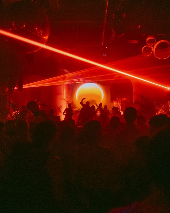 The Rouge dance floor under red lasers